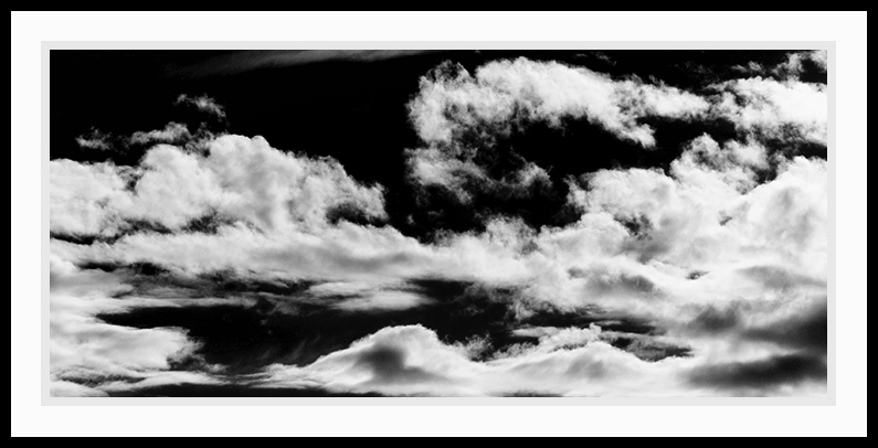 Black and white clouds with an approaching storm.
